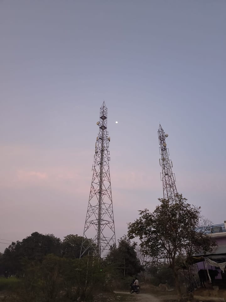 "Two internet network towers in a field and an evening sunlight" by Satyam Vishwakarma (Satya) is marked with CC0 1.0. To view the terms, visit...